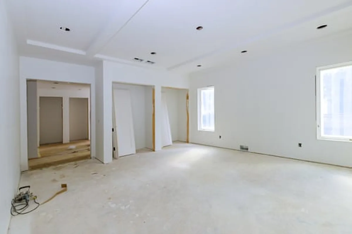 Freshly finished interior room with new cabinets awaiting post-construction cleaning