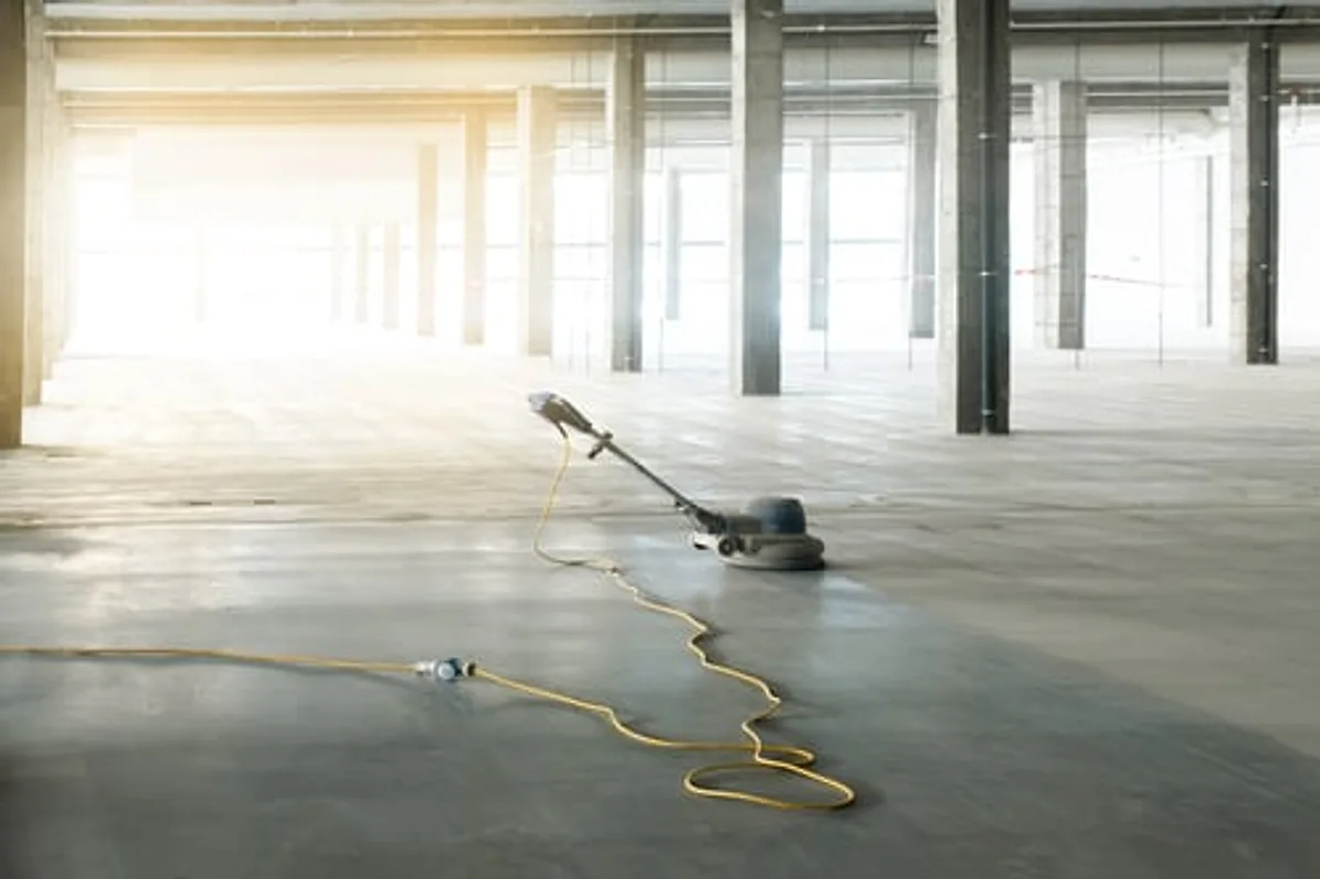 Commercial floor being machine cleaned in a large open business space